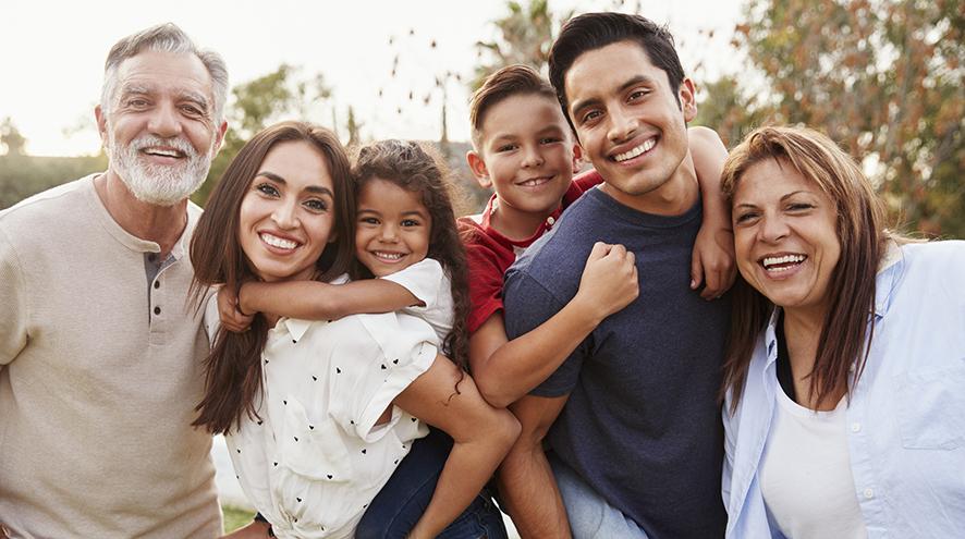 Group of people smiling at the camera.