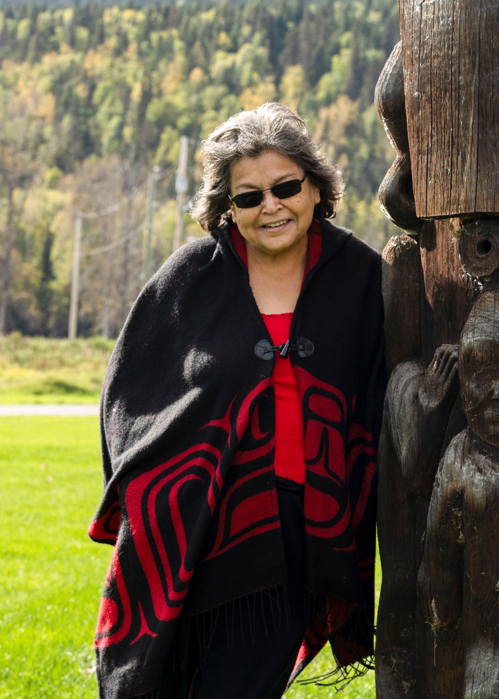 Kay Wilson by the Aspayaxw Totem Poles.