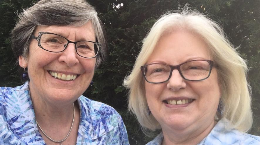 Linda and Ruth smiling and posing for a photo.