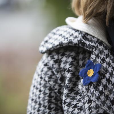 Photo of houndstooth jacket with forget me not brooch