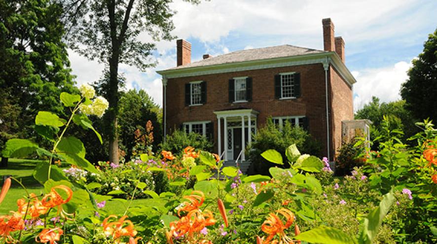 House with flowers in front