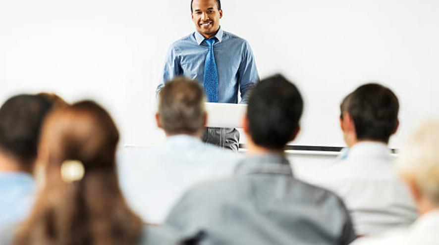 Man lecturing to class