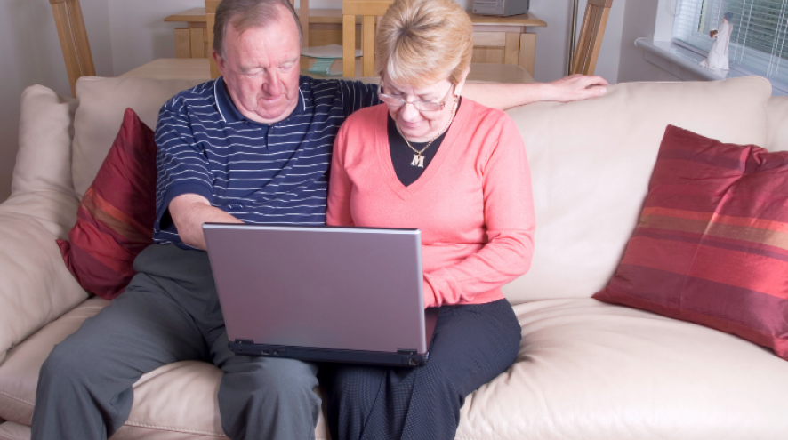 Couple using laptop