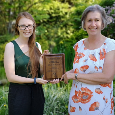 Liz Flogeras being presented with Pauline Spatz Leadership Award by Alzheimer Society staff member