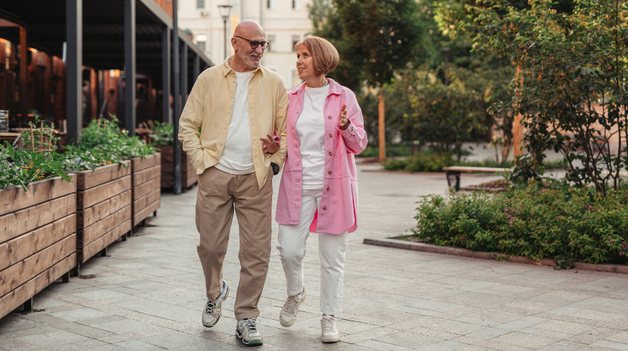 A man and woman walking together and talking