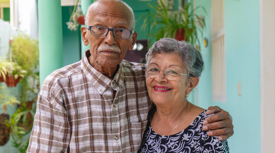 A man and a woman smiling at camera