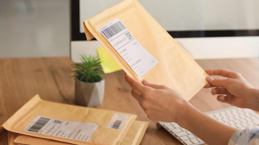 Closeup of envelopes being held