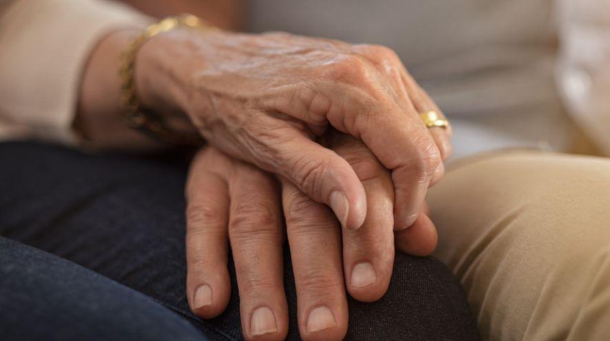 Two people holding hands