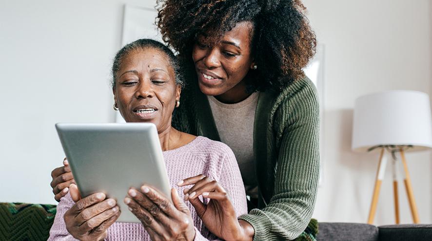 Two women looking at a tablet