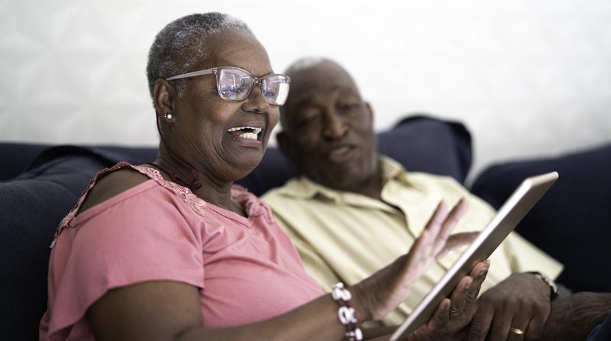 Couple looking at a tablet