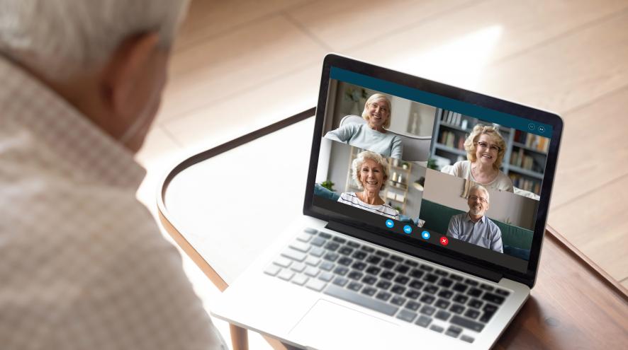 Man on a video call with four people
