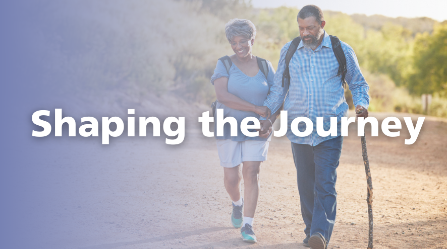 A couple walks down a dirt path holding hands. Text reads "Shaping the Journey"