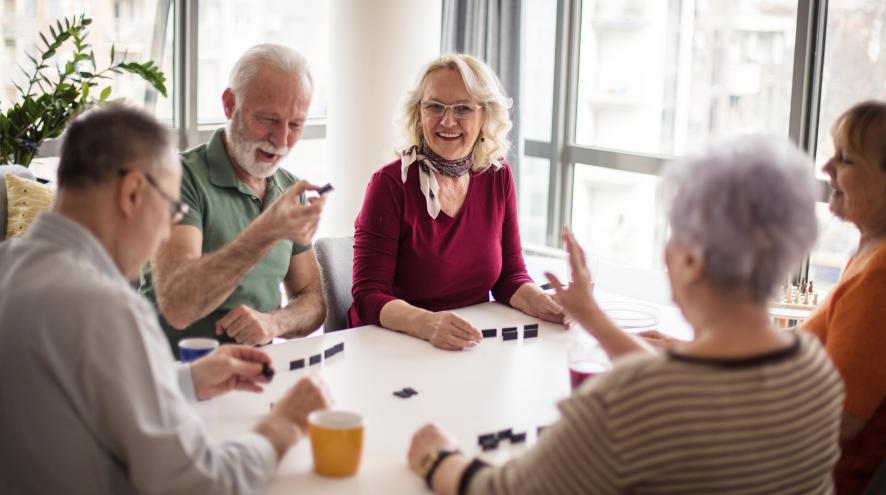 Photo of older adults playing games at a table
