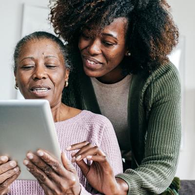 Two women looking at a tablet