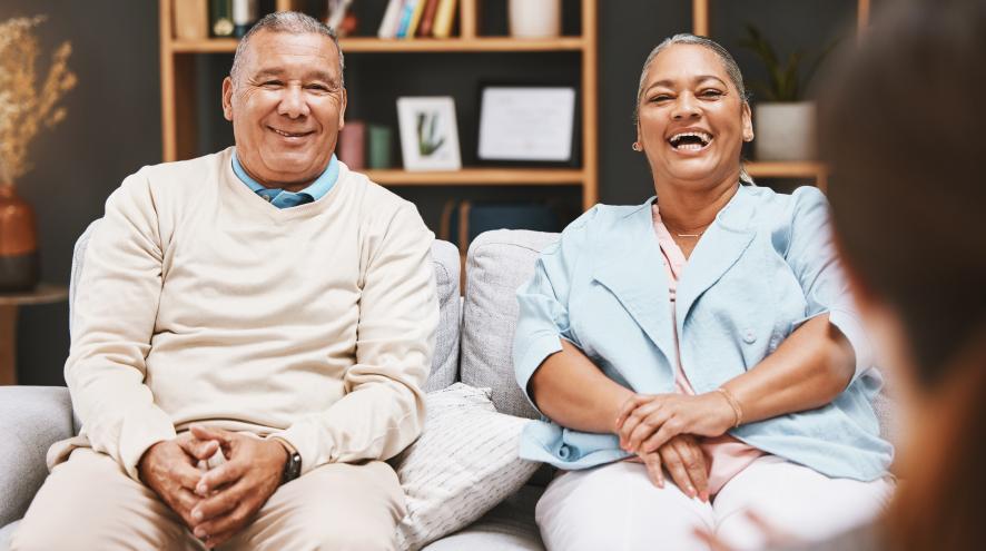 An older couple sitting with a counsellor.