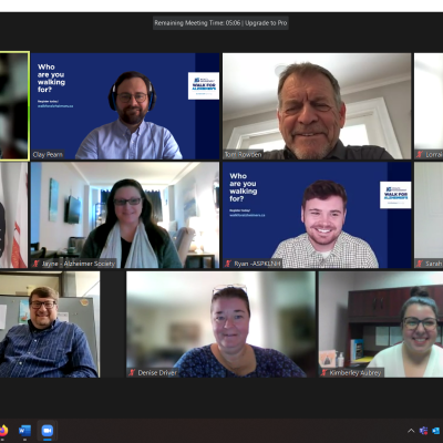 Eleven people smiling for a photo on Zoom