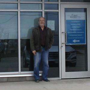 Man standing outside of driving assessment clinic