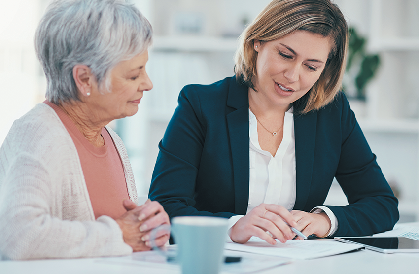 Two women sitting at a table.