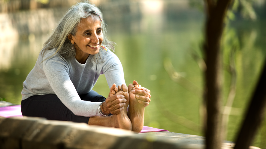 Midlife woman stretching