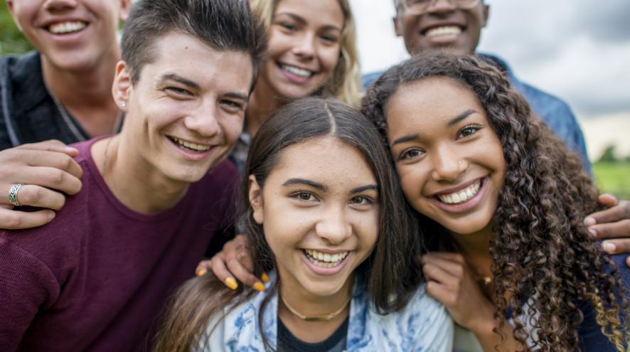 A group of young adults smiling