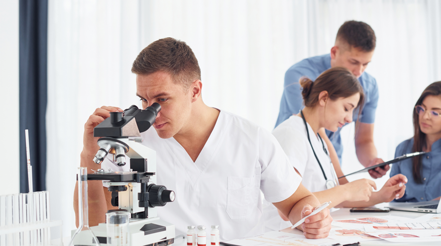 Group of young researchers in a lab