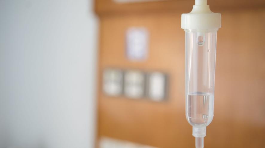 iv bag with office in the background