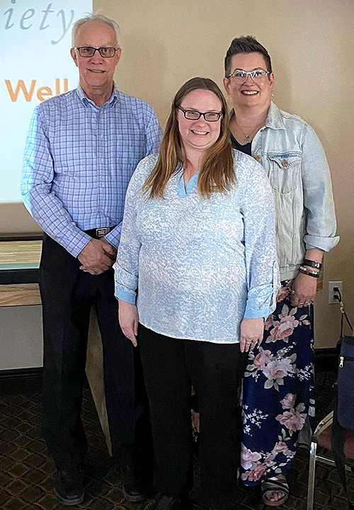 Brent Fraser, General Manager of Caleb Village, standing with our Dementia Community Coordinator and First Link Coordinator