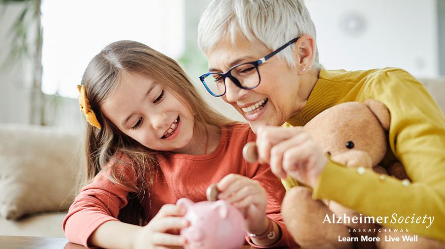 Picture of Grandma and Grandchild putting money into a piggy bank.