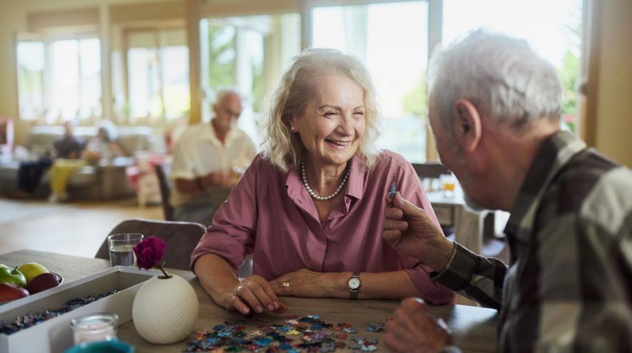 older couple doing puzzle