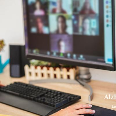 A person talking to a group of people over video chat