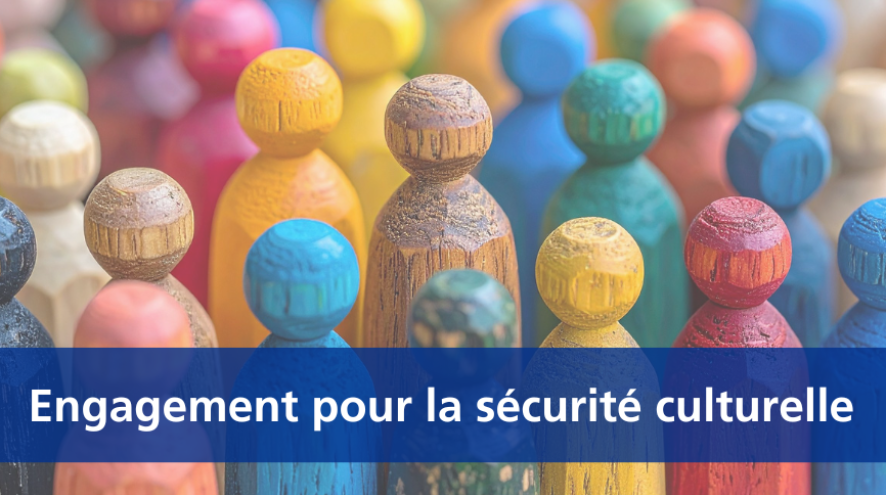 many small multi-coloured wooden figurines with a banner crossing over the bottom of the image that reads "Engagement pour la securite culturelle"