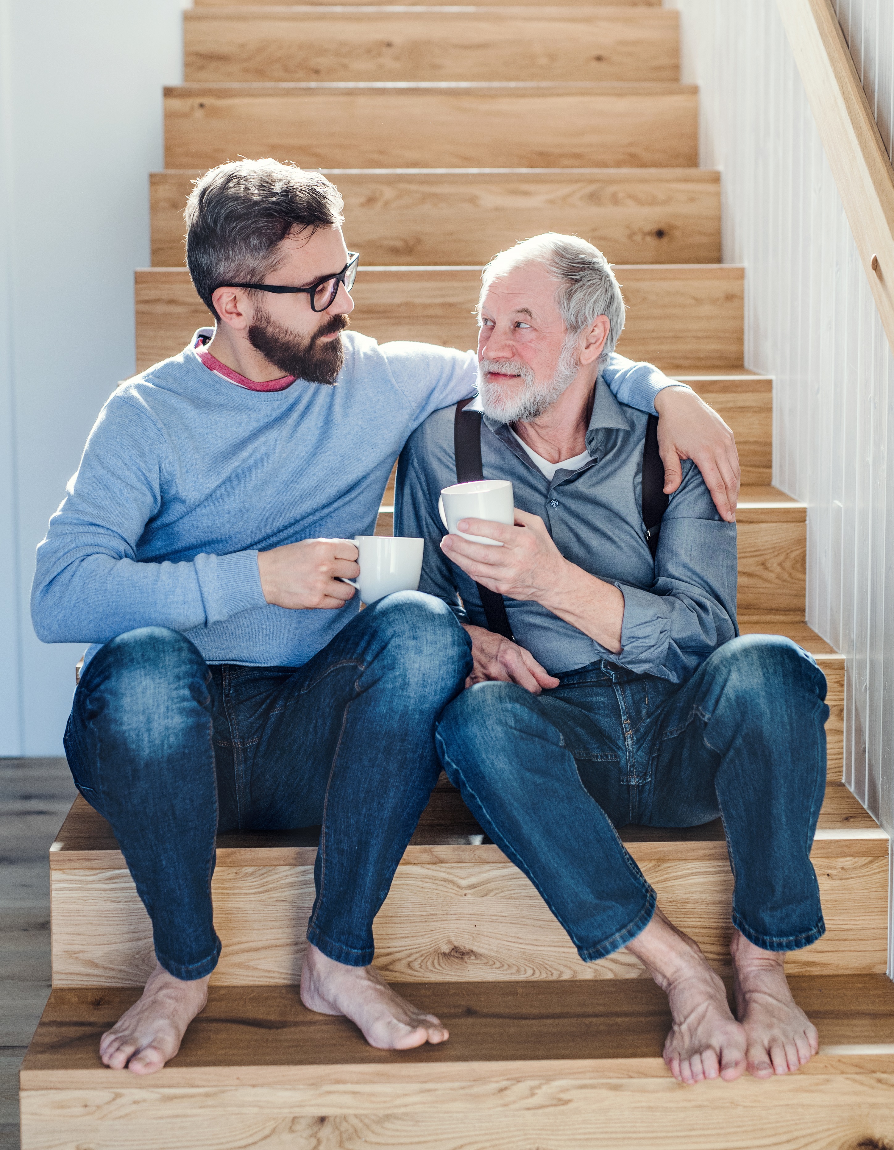two men sharing a cup of coffee