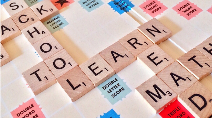Scrabble board with the word Learn spelt out