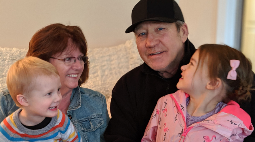 Photo of randy, his wife Lori and their two grandkids