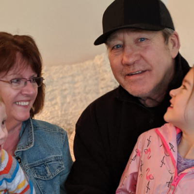 Photo of randy, his wife Lori and their two grandkids